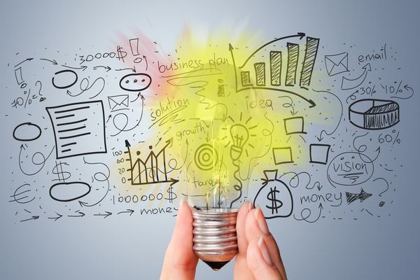 AI-written white paper and business report concept with growth charts and strategy ideas for SME lead generation. A hand holds a yellow lightbulb over written text to show the 'lightbulb' moment