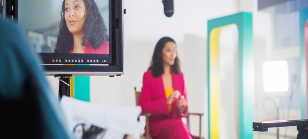 Business spokesperson taking part in a filmed media interview for news and media coverage